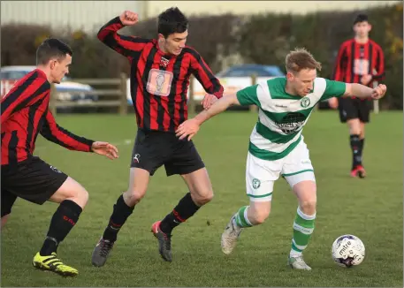  ??  ?? Chris Kenny of Shamrock Rovers, who played with Sligo Rovers last season, is tracked by Gavin O’Brien and Ryan Cullen of Gorey Rangers.