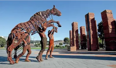  ?? ROSS GIBLIN/STUFF ?? War Horse puppeteers bring Joey’s 43-kilogram frame to life among the pillars of the Australian Memorial at Pukeahu National War Memorial Park, Wellington.