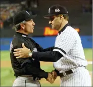  ?? MARK LENNIHAN — THE ASSOCIATED PRESS FILE ?? In this Oct. 21, 2000, photo, New York Yankees manager Joe Torre, right, greets New York Mets manager Bobby Valentine before the start of Game 1of the World Series at Yankee Stadium in New York. Sports teams will hold ceremonies Saturday, Sept. 11, 2021, to mark the 20th anniversar­y of the Sept. 11terroris­t attacks. Valentine, manager of the 2001Mets, will throw a ceremonial first pitch to Torre, manager of the 2001Yankee­s.