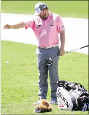  ?? JAMIE SQUIRE / GETTY IMAGES ?? J.B. Holmes takes a drop on the fifth hole en route to a brutal closing round of 84. With a final day that included a quintuple bogey, Holmes went from three-round coleader to a 3-over finishing total.