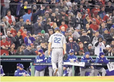  ?? DAVID J. PHILLIP/ASSOCIATED PRESS ?? Los Angeles starter Clayton Kershaw walks off the mound after being taken out of Game 1 of the World Series in the fifth inning. Kershaw allowed five runs in the Dodgers’ loss.