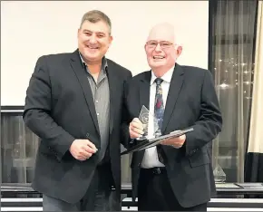  ??  ?? Current Finley High School principal Jeff Ward (left) presents former FHS principal Jim Robertson with his life membership.