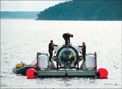  ?? (Courtesy of SeaDoc Society via the Washington Post) ?? The OceanGate operations team is seen at work in this undated photo.