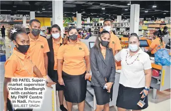  ?? Picture: BALJEET SINGH ?? RB PATEL Supermarke­t supervisor Viniana Bradburgh with cashiers at My FNPF Centre in Nadi.