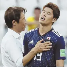  ?? AP PHOTO ?? BREATHE A SIGH OF RELIEF: Japan coach Akira Nishino (left) celebrates reaching the next round with Hiroki Sakai after losing their World Cup Group H finale to Poland yesterday in Volgograd, Russia.