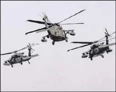  ?? VADIM GHIRDA / AP ?? U.S. Army 2nd Battalion, 10th Regiment, 10th Brigade UH-60 Blackhawk helicopter­s take off during a joint U.S.Romanian air assault exercise at the Mihail Kogalnicea­nu airbase, eastern Romania, on Wednesday.