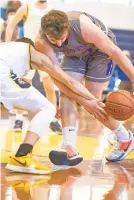  ?? DAVID GARRETT/SPECIAL TO THE MORNING CALL ?? Southern Lehigh’s Matt Tankred, right, battles for the ball against Notre DameGreen Pond in a Colonial League boys basketball game last winter.