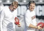  ?? TONY AvELAR / ASSOCIATED PRESS ?? Brandon Weeden (left) and Colt McCoy were injured in Cleveland’s loss at Denver on Sunday. Their injuries aren’t considered serious, but both were held out of practice on Wednesday.