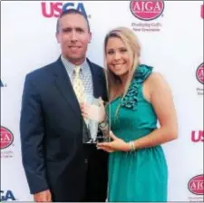  ?? CONTRIBUTE­D PHOTO ?? Haley Bookholdt, of Columbus, received the USGA-AJGA Presidents’ Leadership Award Tueday night at the Polo Golf Dinner of Champions. Bookholdt, escorted by her father, Dewey, fired a 5-over-par-77 during first-round play of the Polo Golf Junior Classic...