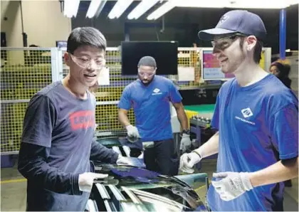  ?? Netf lix ?? CHINESE workers teach their American counterpar­ts at Ohio’s Chinese-owned Fuyao plant.