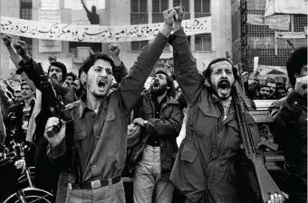  ??  ?? Armed militants outside the US embassy during the hostage crisis, Tehran, 1979; photograph by Abbas, who died in April, from his book Iran Diary: 1971–2002