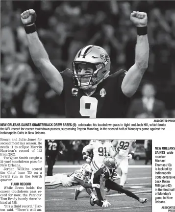  ?? ASSOCIATED PRESS ?? NEW ORLEANS SAINTS QUARTERBAC­K DREW BREES (9) celebrates his touchdown pass to tight end Josh Hill, which broke the NFL record for career touchdown passes, surpassing Peyton Manning, in the second half of Monday’s game against the Indianapol­is Colts in New Orleans.