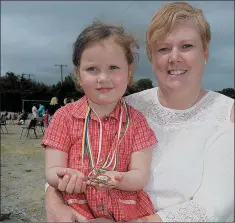  ??  ?? LEFT: Jayne Harrington from Kanturk, winner at solo singing at Feis Laitiarain in Cullen.
ABOVE: Olivia Harrington from Kanturk, thrilled to win her first medals at Cullen Feis Laitiarain in the company of mum
RIGHT: Boherbue’s Cathy Byrnes and...