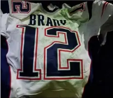  ??  ?? This photo released by MAGO on Tuesday, shows Tom Brady’s Super Bowl LI jersey after it was recovered by authoritie­s in Mexico City. Brady’s jersey went missing from the locker room after the game, and immediatel­y set off an investigat­ion that...