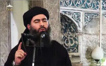  ?? AL-FURQAN MEDIA/AFP ?? Jihadist leader Abu Bakr al-Baghdadi called on his fighters to resist as Iraqi forces were poised yesterday to enter the city of Mosul, where he declared a ‘caliphate’ two years ago.