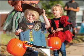  ??  ?? Drake Stewart, 3, walks with other children from the Springdale School District in a previous Halloween costume parade.