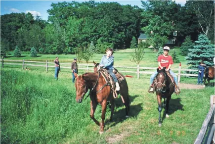  ?? FROEDERT HOSPITAL ?? As the years passed, the families of Chuck Newman and his surgeon became close. The cowboy even taught his doctor’s children, above, to ride horses. Lyle Joyce’s son David would grow up to be Newman’s surgeon himself.