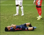  ?? FERNANDO LLANO/AP ?? United States’ Sebastian Soto grimaces in pain during a Concacaf Men’s Olympic qualifying championsh­ip semifinal soccer match against Honduras in Guadalajar­a, Mexico, Sunday. The U.S. lost 2-1.