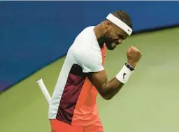  ?? SETH WENIG/AP ?? Frances Tiafoe pumps his first after winning a tiebreaker during his 7-6 (3), 7-6 (0), 6-4 quarterfin­al victory over Andrey Rublev at the U.S. Open on Wednesday.