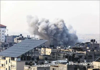  ?? Abed Rahim Khatib Anadolu Agency ?? SMOKE RISES after Israeli attacks hit Rafah, in the southern Gaza Strip, on Dec. 1 after a temporary truce ended.