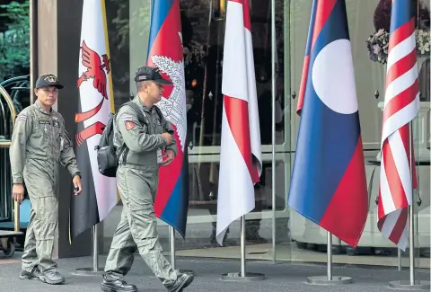  ??  ?? Bomb squad personnel inspect the area outside The Athenee Hotel, the venue for the 34th Asean Summit and related meetings which Thailand is hosting from tomorrow until Sunday. Security has been tightened around the venue and at hotels where the leaders will stay.