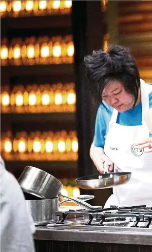  ??  ?? Tiong (left) and Chan cook side by side in the MasterChef kitchen.