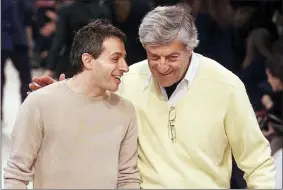  ?? MICHEL EULER — THE ASSOCIATED PRESS FILE ?? American-Greek designer Peter Speliopoul­os, left, and Nino Cerruti talk on the catwalk after their fall-winter ready-to-wear fashion show presentati­on March 15, 2001in Paris.