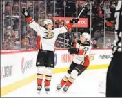  ?? Michael Martin NHLI via Getty Images ?? RICKARD RAKELL, left, and Christian Djoos enjoy Rakell’s winning goal in overtime for the Ducks.
