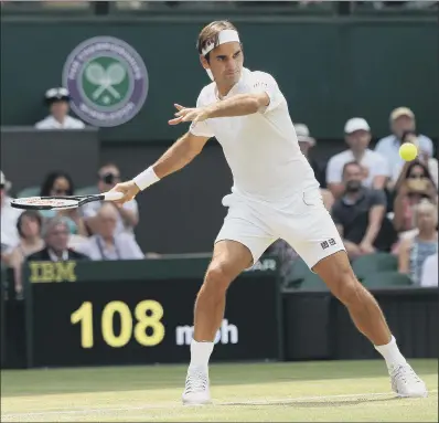  ?? PICTURE: JONATHAN BRADY/PA WIRE ?? HEADING FOR THE LAST EIGHT: Roger Federer returns on his way to a 6-0 7-5 6-4 victory over Adrian Mannarino. It put the Swiss into the Wimbledon quarter-finals for the 16th time as he chases a ninth men’s singles title.