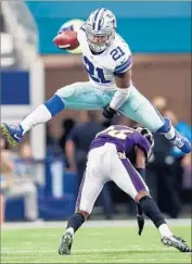  ?? Steve Nurenberg Fort Worth Star Telegram ?? DALLAS’ Ezekiel Elliott leaps over Baltimore’s Tavon Young. Elliott has 1,285 yards rushing.