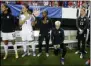  ?? JOHN BAZEMORE - THE ASSOCIATED PRESS ?? FILE - In this Sept. 18, 2016, file photo, United States’ Megan Rapinoe, right, kneels next to teammates Christen Press (12), Ali Krieger (11), Crystal Dunn (16) and Ashlyn Harris (22) as the national anthem is played before the team’s exhibition soccer match against the Netherland­s in Atlanta.