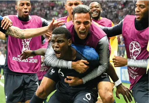  ??  ?? TOP OF THE WORLD: France’s Paul Pogba celebrates after scoring his side’s third goal during the final against Croatia.