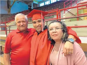  ?? COURTESY OF JAIME CERVANTES ?? Jaime Cervantes, center, is shown at UNM’s Hispanic-focused Raza graduation event last week with his parents, Jose and Maria.