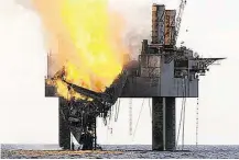  ?? U.S. Coast Guard / Associated Press file ?? A rig operated by Hercules Offshore caught fire in the Gulf of Mexico in 2013. A report faulted two Houston companies.