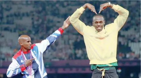  ?? — Reuters ?? Jamaica’s Usain Bolt (R) celebrates with Britain’s Mo Farah on the podium after each receiving gold medals, Bolt for men’s 4x100m relay and Farah for men’s 5,000m at the victory ceremony of the London 2012 Olympic Games at the Olympic Stadium on August 11, 2012.