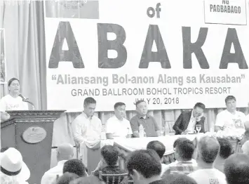  ?? RIC V. OBEDENCIO ?? Davao City Mayor Sara "Inday" Duterte (at the rostrum) speaks during the launching of multi-sectoral movement called Alyansang Bol-anon alang sa Kausaban or Abaka. Seated on stage are (L-R) Secretarie­s Martin Andanar, Francis Tolentino, and Harry Roque, lawyer Salvador Panelo, Abaka president Norris Oculam, and Cabinet Sec. Jun Evasco (partly hidden, right).