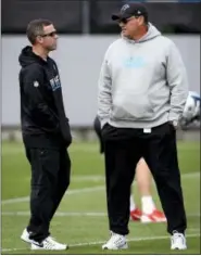  ?? JEFF SINER — THE CHARLOTTE OBSERVER VIA AP ?? Carolina Panthers assistant general manager Brandon Beane, left, and head coach Ron Rivera, right, speak during the team’s second session practice of the rookie minicamp earlier this month. The Buffalo Bills hired Beane to fill their general manager...