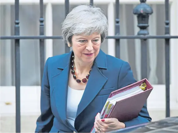  ?? Picture: PA. ?? Tough balancing act: Prime Minister Theresa May is selling a deal to the Cabinet, and Alex believes she may just succeed.