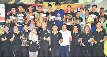  ??  ?? Men’s Open category winners including Soh (back row, fourth from left) pose with (front row) Tiong (fifth from left) and Rogayah (fourth from left).