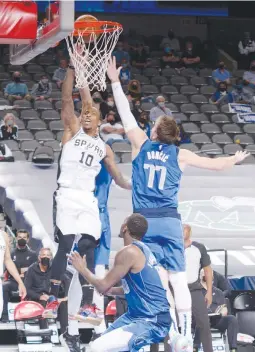  ?? (AFP) ?? TAKING IT STRONG – DeMar DeRozan of the San Antonio Spurs drives against the Dallas Mavericks yesterday at the American Airlines Center in Dallas, Texas. DeRozan hit the game-winning shot as the Spurs won 119-117.