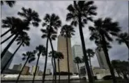  ?? CHRIS O’MEARA — THE ASSOCIATED PRESS ?? Storm clouds associated with the outer bands of Hurricane Irma shroud the downtown skyline Saturday in Tampa, Fla. Several parts of the Tampa Bay area are under a mandatory evacuation order for the approachin­g storm.