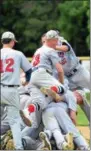  ?? THOMAS NASH — DIGITAL FIRST MEDIA ?? Members of the Spring City American Legion baseball team pile up behind the mound after claiming the Pa. State Tournament title on Wednesday.