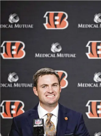  ?? JOE ROBBINS / GETTY IMAGES ?? Zac Taylor wasn’t ready to divulge names or confirm any rumored hires Tuesday when he met with the press in Cincinnati, but said he is close to being able to make some announceme­nts.