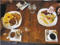  ??  ?? Top: The Gold Rush-era town of Sutter Creek is quiet looking out from inside Element, the breakfast and lunch restaurant at Hanford House Inn. Above: Jack and Tamara Papazian chat with friends as they enjoy breakfast. The group has been visiting the...