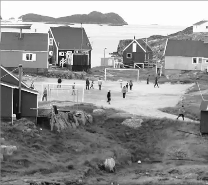  ?? DON BUTLER / CANWEST NEWS SERVICE ?? A gravel soccer pitch dominates the centre of Itilleq, a fishing village on Greenland’s west coast. Visiting Canadians discovered it’s well- used.