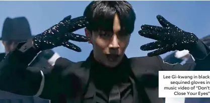  ??  ?? Lee Gi-kwang in black sequined gloves in music video of “Don’t Close Your Eyes”