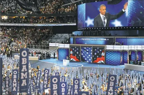  ?? Matt Freed/Post-Gazette photos ?? President Barack Obama acknowledg­es cheers from the crowd as he takes the stage at the Democratic National Convention in Philadelph­ia on Wednesday night.