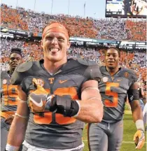  ?? STAFF FILE PHOTO BY ROBIN RUDD ?? Tennessee’s Colton Jumper, front, celebrates as he leaves the field after the Vols’ victory over Florida last September at Neyland Stadium. Jumper was among the linebacker­s who gained valuable experience last season because of injuries to veteran...