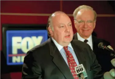  ?? RICHARD DREW — THE ASSOCIATED PRESS FILE ?? In this file photo, Roger Ailes, left, speaks at a news conference as Rupert Murdoch looks on after it was announced that Ailes will be chairman and CEO of Fox News. Fox News said on Thursday that Ailes has died. He was 77.