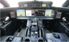  ?? SIMON DAWSON / BLOOMBERG ?? The cockpit of a Gulfstream G500 executive jet on display Monday at the the U.K.’s Farnboroug­h air show. The industry to looking at a one-pilot cockpit to cut costs.